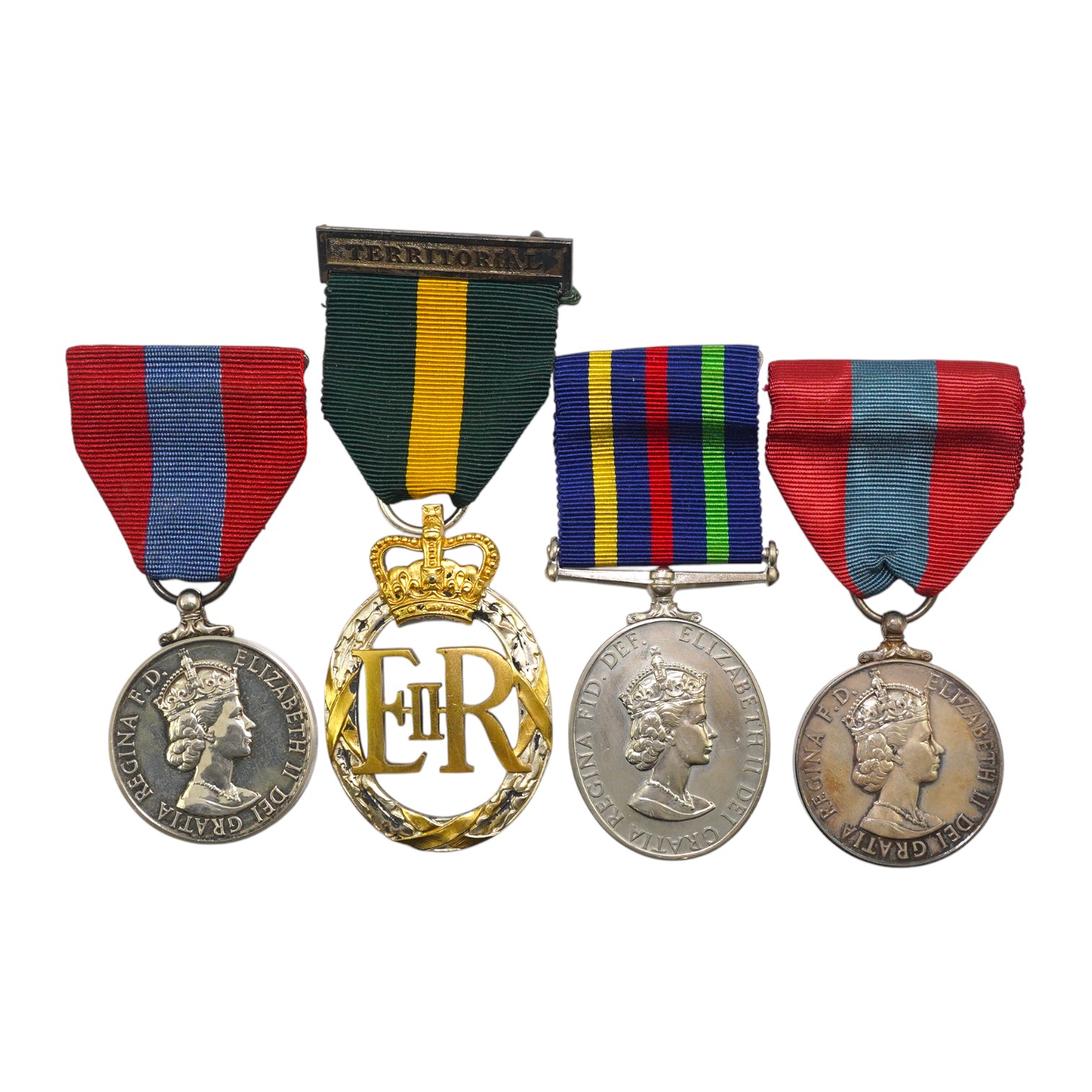 Four ERII service medals; Imperial Service medal to Alexander Manuel, another to Sydney John Jeffery (Technician Class IIA, Telecommunications Headquarters; Civil Defence Long Service unnamed; Territorial Efficiency Deco